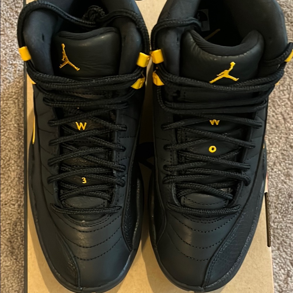 NIB. Jordan 12 Retro Black and Yellow (Big Kid) size 5 Men’s